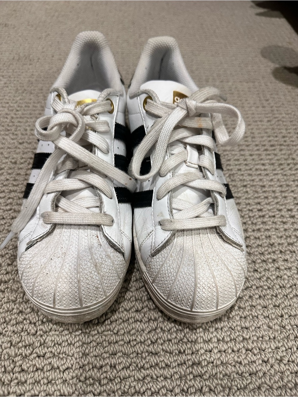 adidas White Sneakers with Black Stripes and Gold Accents